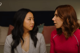 Ruby (played by Stephanie Hsu) and AJ (played by Zosia Mamet) look at each other with surprise and concern.